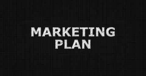 MARKETING PLAN text on board Illustrazione stock