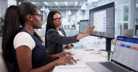 Marketing Specialists Collaborate Closely While Analyzing Sales Funnel Data O Stock Photos