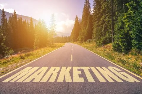 Marketing word written on road in the mountains Stock Photos