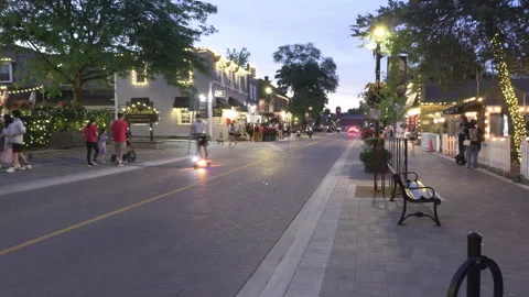 Markham, Canada May 23 2026 People walking in small town on hot summer night Stock Footage 338122386