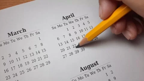 Marking april date on the calendar Video stock 296143626