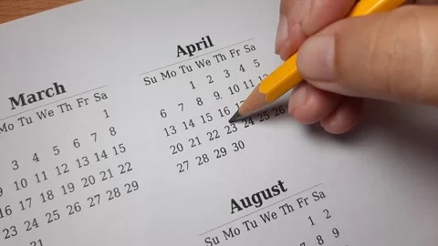 Marking april date on the calendar Video stock 296143636