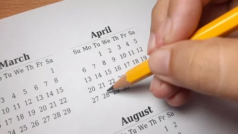 Marking april date on the calendar Video stock 296143649