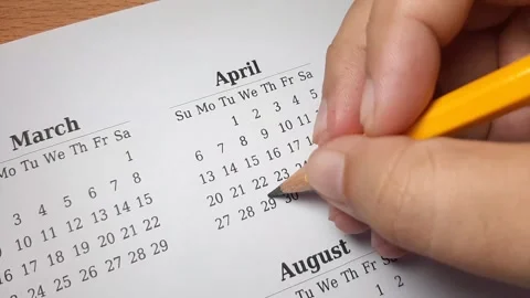 Marking april date on the calendar Video stock 296143650