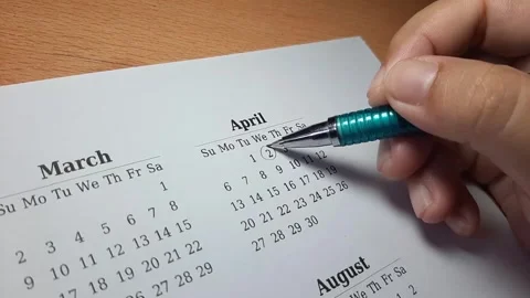Marking april date on the calendar Video stock 296143660