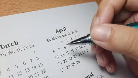 Marking april date on the calendar Video stock 296143661