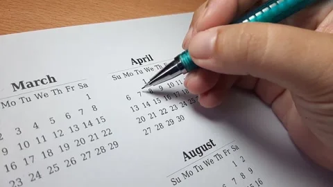 Marking april date on the calendar Video stock 296143667