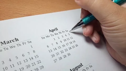 Marking april date on the calendar Video stock 296143668