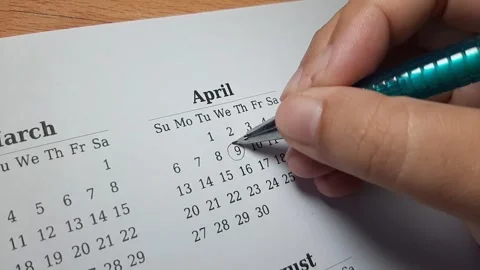 Marking april date on the calendar Video stock 296143673
