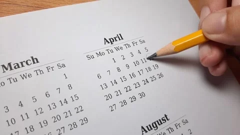 Marking april date on the calendar Video stock 296143677