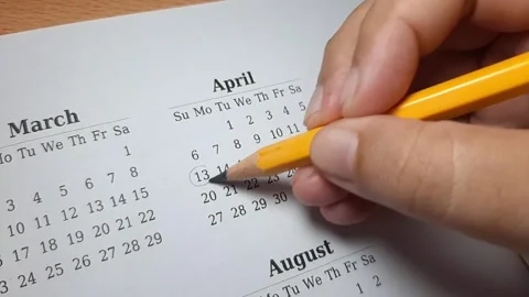 Marking april date on the calendar Video stock 296143680