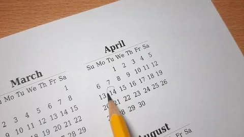 Marking april date on the calendar Video stock 296143681
