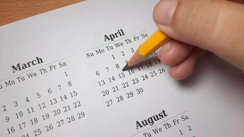 Marking april date on the calendar Video stock 296143686