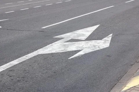 Marking of the arrow pointer on the asphalt road Stock Photos