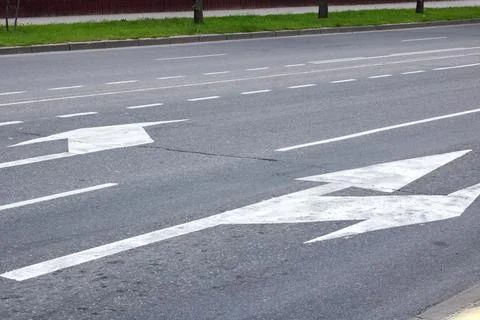 Marking of the arrow pointer on the asphalt road Stock Photos