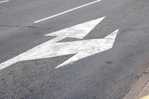 Marking of the arrow pointer on the asphalt road Stock Photos