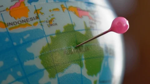 Marking Australia with Tailor Pin on Globe Ball Close Up Video stock 116624560