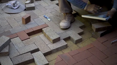 Marking a brick for cuts for a custom designed and cut brick pattern as part of Stock Footage 81590841