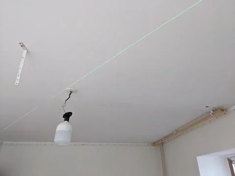 Marking on the ceiling. Installation of a stretch ceiling Stock Photos