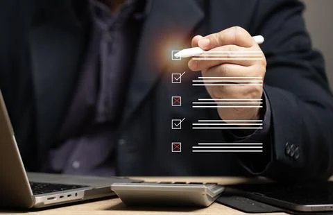 Marking on checklist box isolated on virtual screen. Checklist concept. Han.. Stock Photos