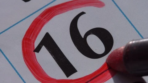 Marking the date in the calendar with a red marker Stock Footage 99295448