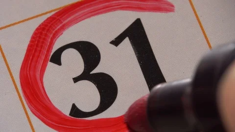 Marking the date in the calendar with a red marker Stock Footage 99295813