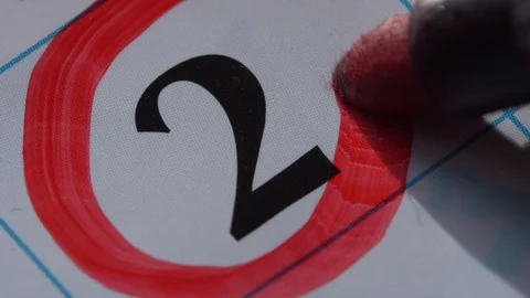 Marking the date in the calendar with a red marker Stock Footage 99295905