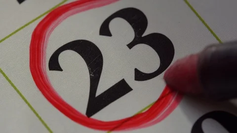 Marking the date in the calendar with a red marker Stock Footage 99296343