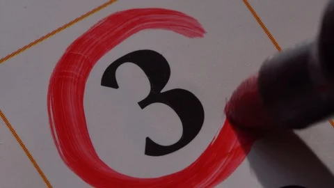 Marking the date in the calendar with a red marker Stock Footage 99296563