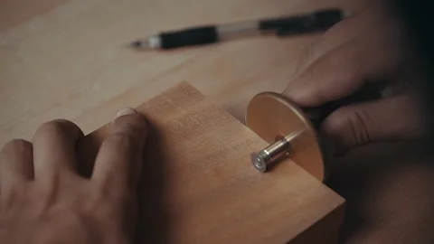 Marking Depth for Precise Mahogany Dowel Joints with a Mortise Gauge Stock Footage 252143648