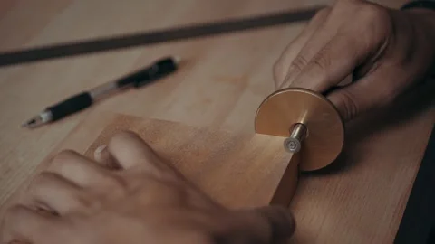 Marking Depth for Precise Mahogany Dowel Joints with a Mortise Gauge Stock Footage 252143706