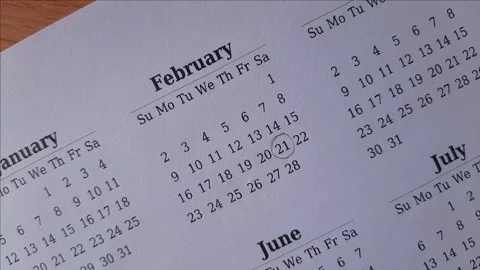 Marking February date on the calendar Stock Footage 295470565