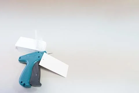 Marking gun. A working tool for attaching labels. Textile industry. Copy spac Stock Photos