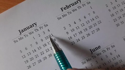 Marking January date on the calendar Stock Footage 295469684