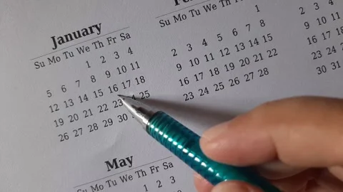 Marking January date on the calendar Stock Footage 295469938