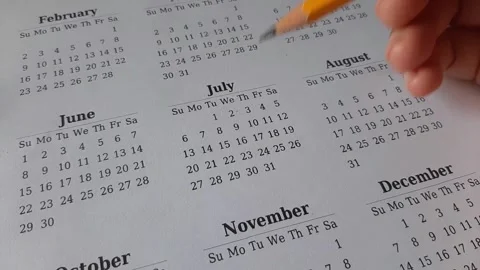 Marking July date on the calendar Stock Footage 311436298