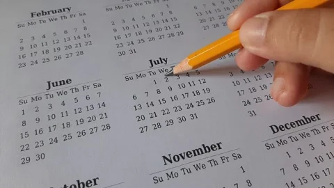 Marking July date on the calendar Stock Footage 311436299