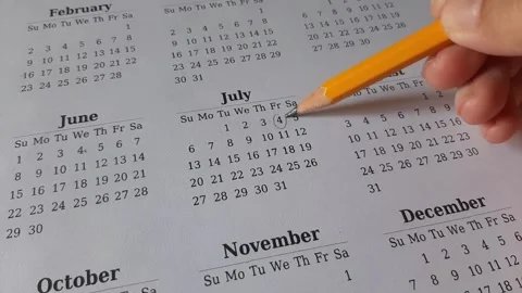 Marking July date on the calendar Stock Footage 311436301