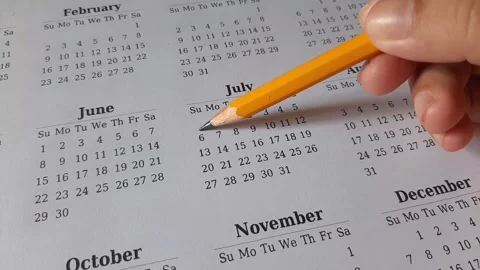 Marking July date on the calendar Stock Footage 311436621