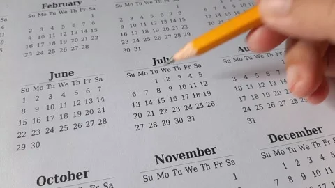 Marking July date on the calendar Stock Footage 311436724