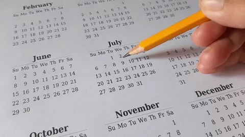 Marking July date on the calendar Stock Footage 311436732