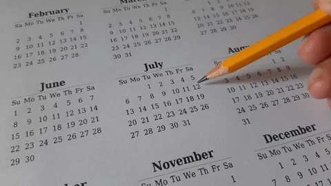 Marking July date on the calendar Stock Footage 311437163