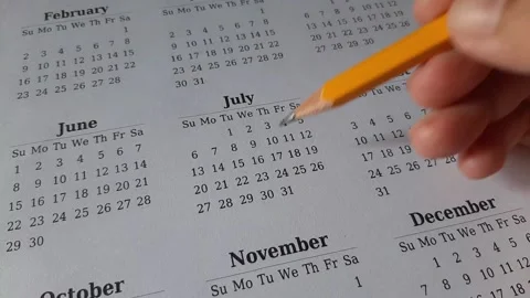 Marking July date on the calendar Stock Footage 311437907