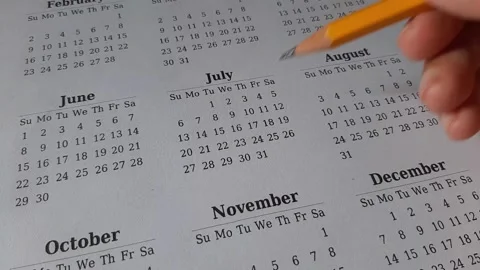 Marking July date on the calendar Stock Footage 311438051