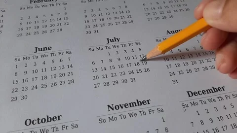 Marking July date on the calendar Stock Footage 311438059