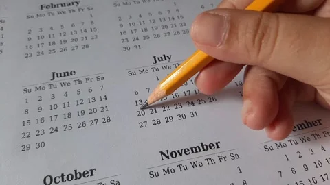 Marking July date on the calendar Stock Footage 311438430