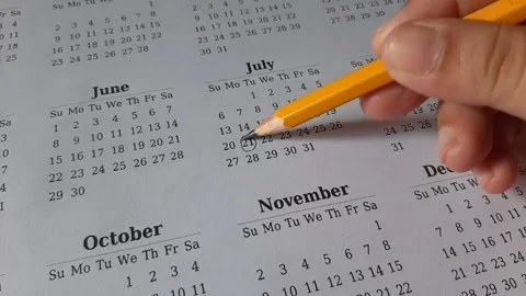 Marking July date on the calendar Stock Footage 311438604