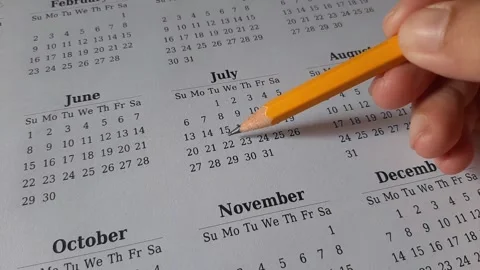 Marking July date on the calendar Stock Footage 311438746
