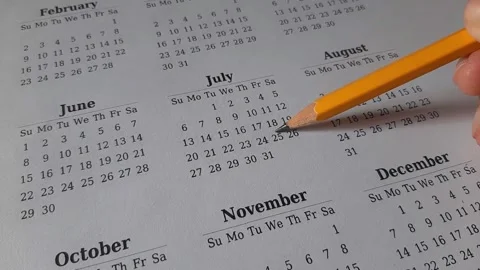 Marking July date on the calendar Stock Footage 311439230