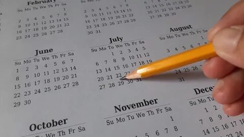 Marking July date on the calendar Stock Footage 311439482